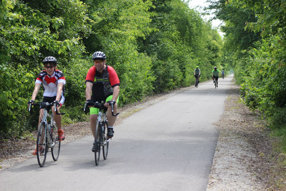 Pairs of cyclists on the Tallgrass bike trail in Marion.