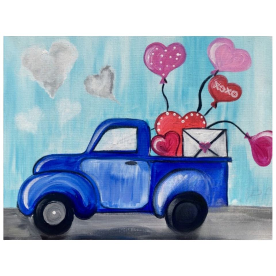 Older model blue truck with hearts hanging out the back
