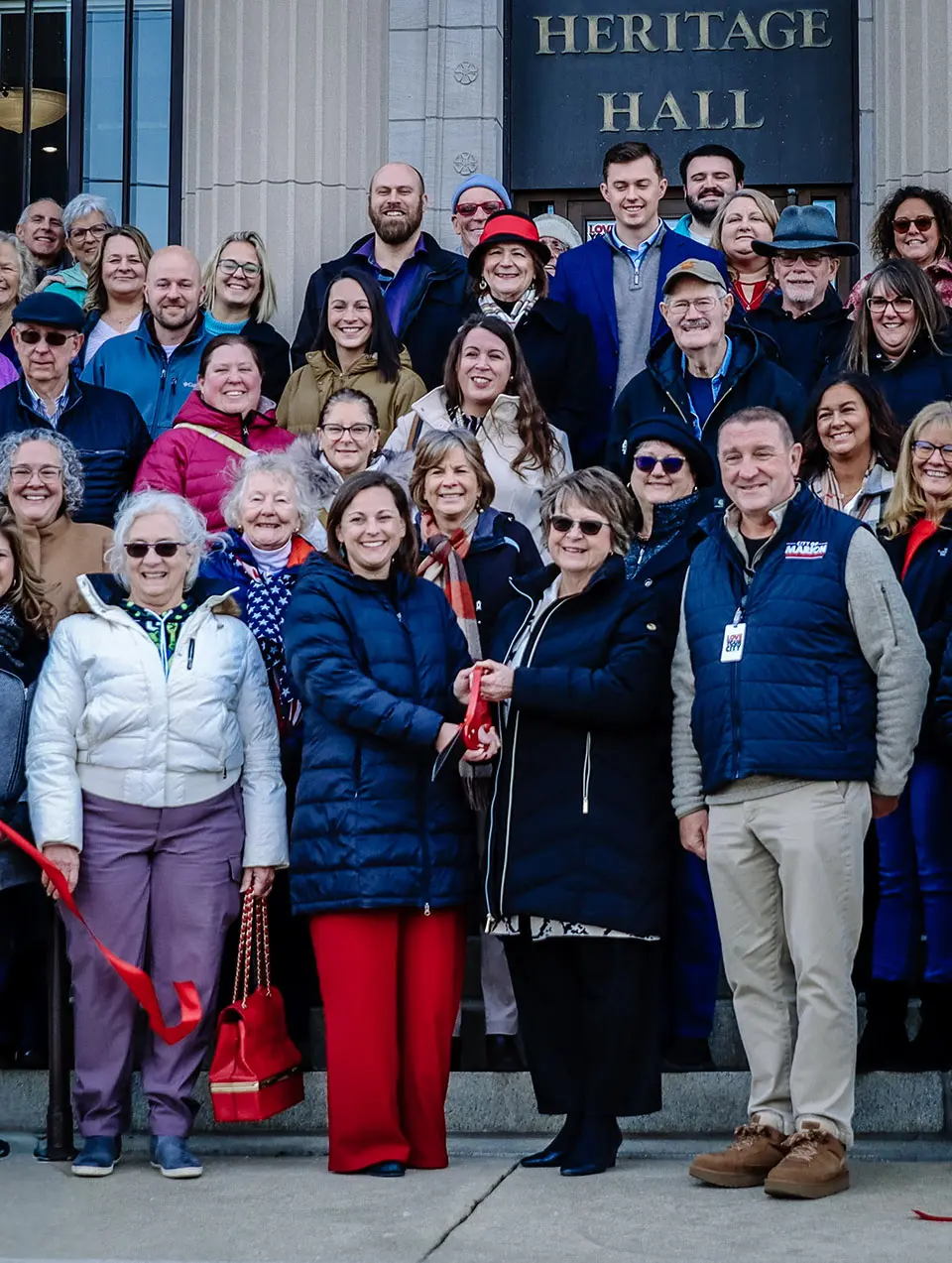 Group gathers for photo at ribbon-cutting